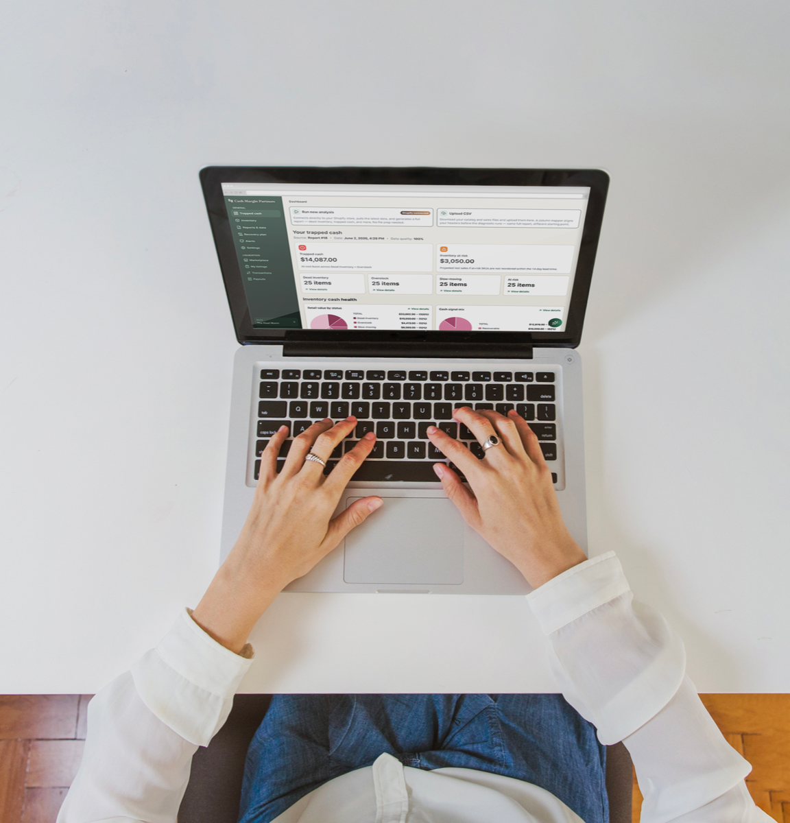 An operator reviewing an inventory dashboard on a laptop